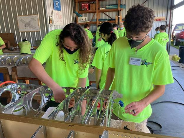 Students involved in the Teen Aircraft Factory of Manasota put their STEM skills to the test. Pictured is Connor Vice and Paul Moyers working on the electronics on a wing of an airplane.